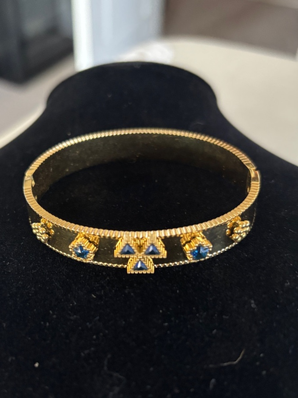 Gold-Tone Bangle Bracelet with Blue Accent Stones